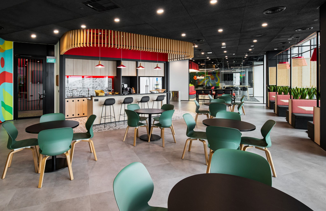 interior of office lounge decorated in Red Hat branded colors