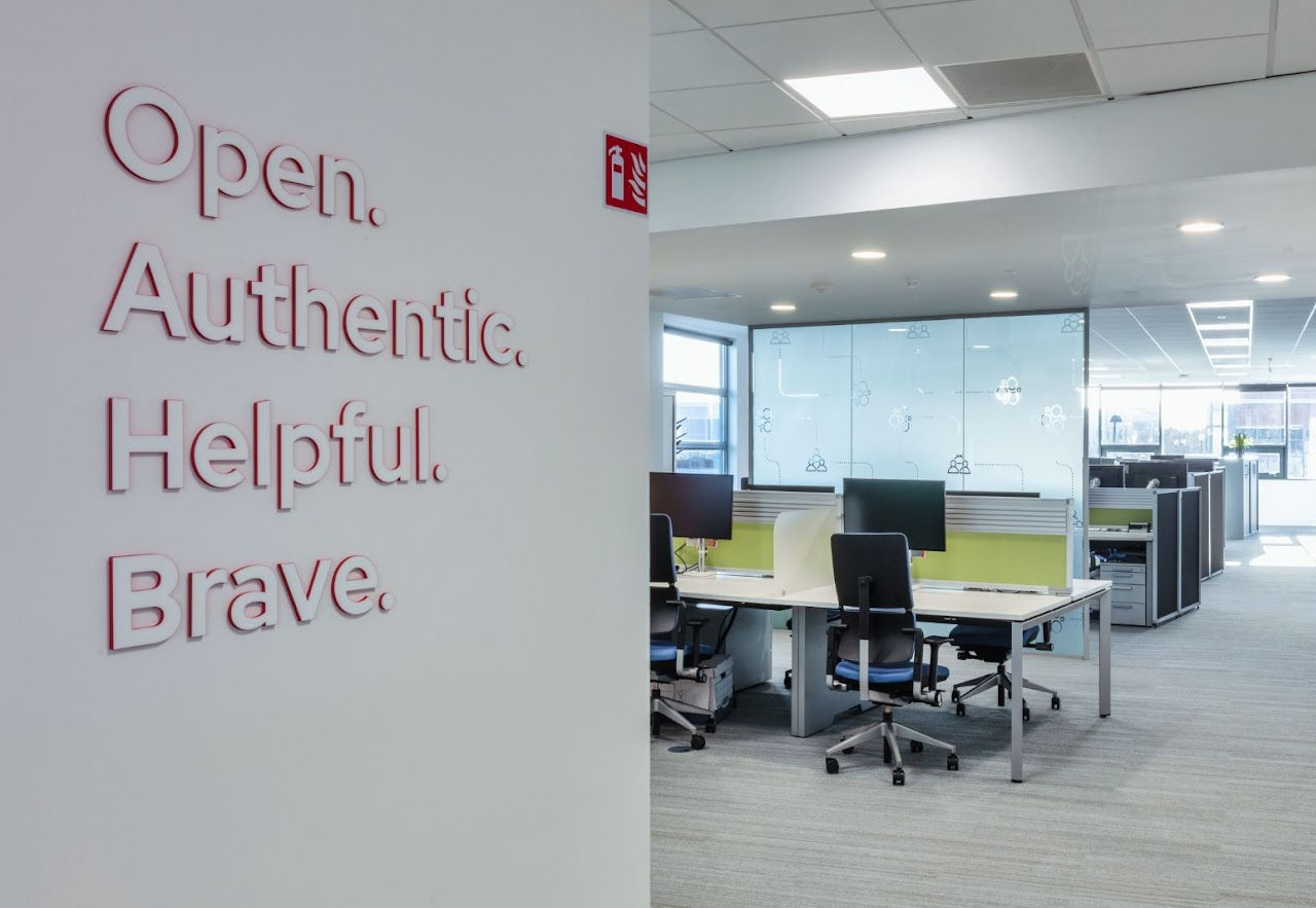 entry way into an office space with the words Open Authentic Helpful Brave