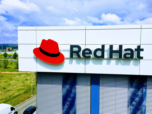 Red Hat logo display on exterior building signage