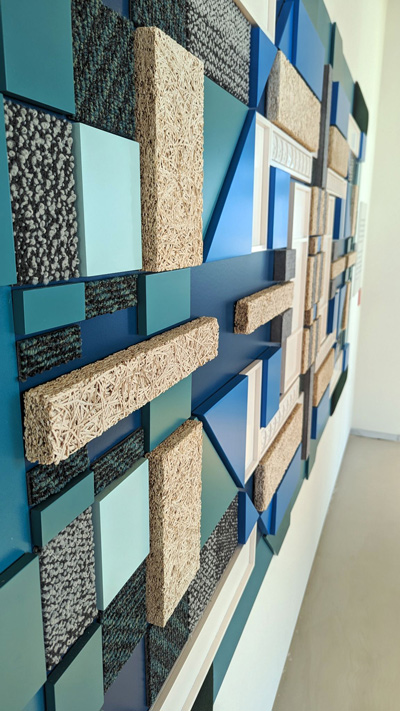 wall art composed of geometric shapes of various sustainable materials