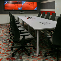 Conference room with red and grey geometric wall.