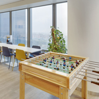 Spacious breakroom or casual meeting area with city views.
