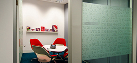 Small interview room with a table and four chairs