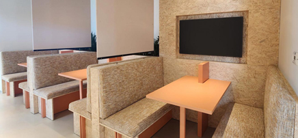 Cozy workspace with light wood desk.