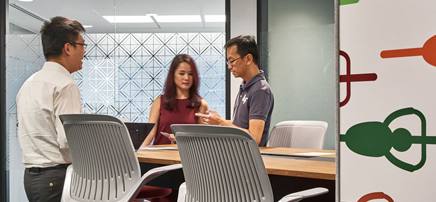 people having a discussion in an office